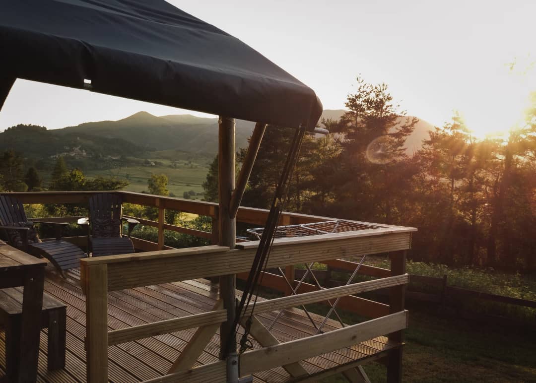 The lodge’s terrace with a view of the Pyrenees at sunset